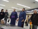 Sumo wrestlers (I assume) at the airport